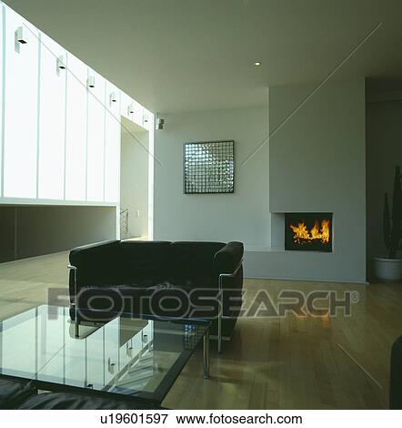 Modern livingroom with black Le Corbusier sofa and glass table View Large Photo Image Stock Photo - Modern livingroom with black Le Corbusier sofa and glass table. Fotosearch