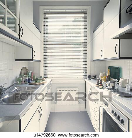 Narrow Kitchen with White Fitted Cupboards View Large Photo Image Stock Image - Narrow Kitchen with White Fitted Cupboards. Fotosearch