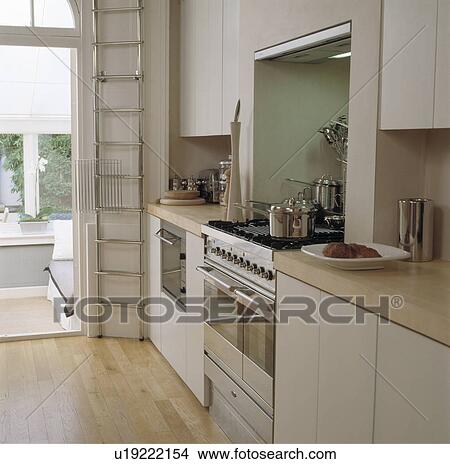 Neutral decoration achieves tranquil feel in this traditional house kitchen. View Large Photo Image Picture - Neutral decoration achieves tranquil feel in this traditional house kitchen.. Fotosearch