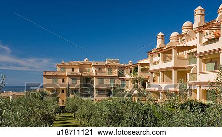 Neutral modern apartment building in holiday village in southern Spain View Large Photo Image Stock Image - Neutral modern apartment building in holiday village in southern Spain. Fotosearch
