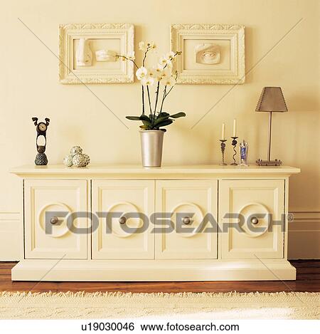Stock Photograph - Neutral themed Livingroom with Sideboard.. Fotosearch