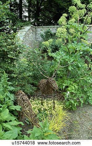 Novelty sculpture in country garden View Large Photo Image Stock Photo - Novelty sculpture in country garden. Fotosearch