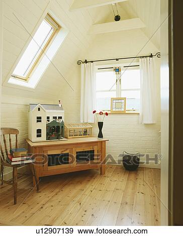 Stock Photo - Old style unconverted attic with striped pine flower.. Fotosearch