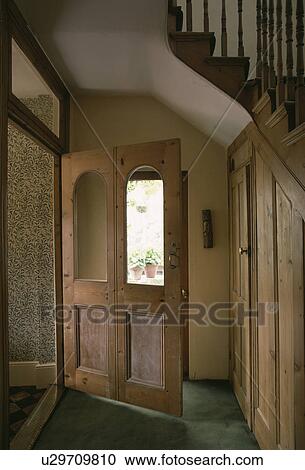 Old wooden door with glazed panels in small hall with understair cupboard View Large Photo Image Stock Image - Old wooden door with glazed panels in small hall with understair cupboard. Fotosearch
