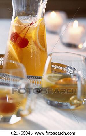 Orange fruit drink in glass pitcher and glasses. View Large Photo Image Stock Photography - Orange fruit drink in glass pitcher and glasses.. Fotosearch