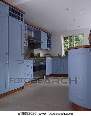 Pale blue painted contemporary wooden kitchen with open tiled floor. View Large Photo Image Stock Photograph - Pale blue painted contemporary wooden kitchen with open tiled floor.. Fotosearch