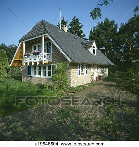 Path and lawn to small modern house with balcony View Large Photo Image Picture - Path and lawn to small modern house with balcony. Fotosearch