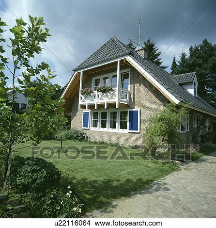 Path and lawn to small modern house with balcony View Large Photo Image Picture - Path and lawn to small modern house with balcony. Fotosearch