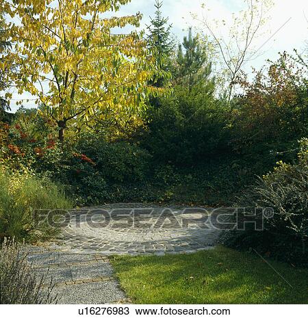 Patio in country garden in summer View Large Photo Image Stock Image - Patio in country garden in summer. Fotosearch