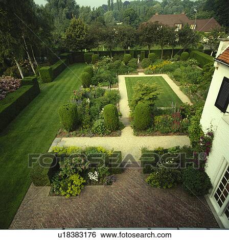 Stock Photograph - Patio in country garden in summer. Fotosearch