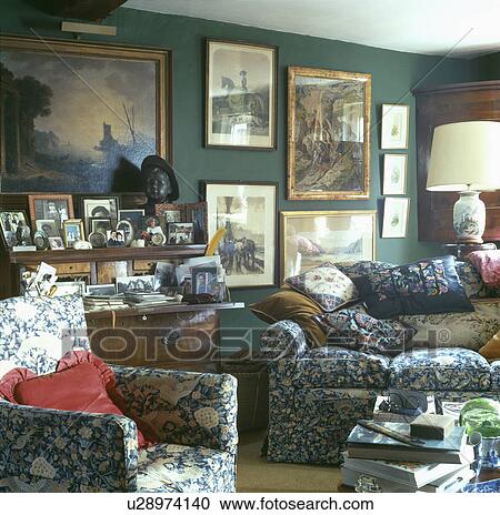 Pattered sofa in cluttered cottage living room View Large Photo Image Stock Image - Pattered sofa in cluttered cottage living room. Fotosearch