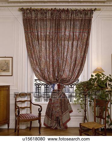 Patterned Curtains In Traditional Living Room Stock Image