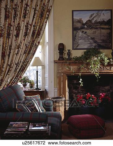 Patterned curtains in traditional living room View Large Photo Image Stock Image - Patterned curtains in traditional living room. Fotosearch