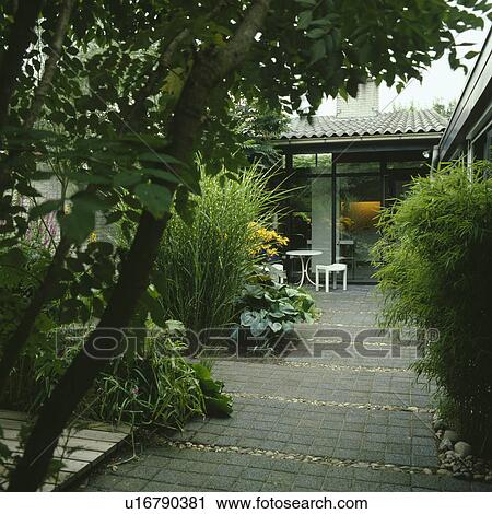 Stock Image - Paved patio in summer. Fotosearch