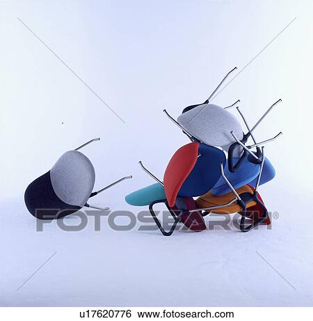 Pile of assorted coloured stacking chairs. View Large Photo Image Stock Photograph - Pile of assorted coloured stacking chairs. . Fotosearch