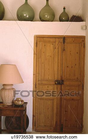 Pine doors in cottage living room View Large Photo Image Stock Photo - Pine doors in cottage living room. Fotosearch