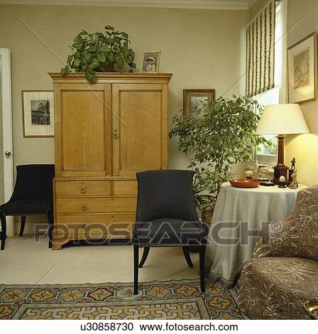 PIne linen press in traditional living room View Large Photo Image Stock Image - PIne linen press in traditional living room. Fotosearch