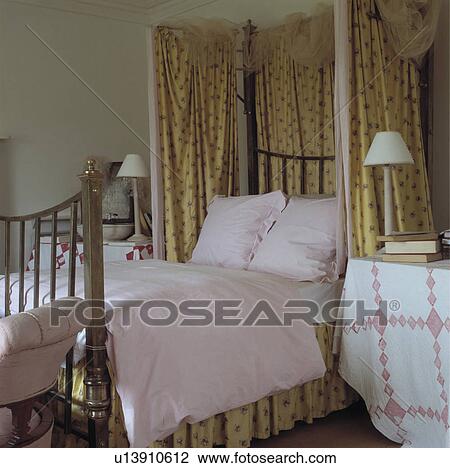 Pink Pillows And Duvet On Antique Brass Half Tester Bed With