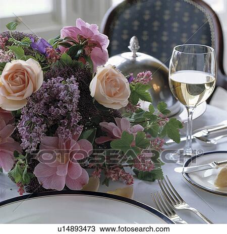 Pink roses and purple lilac wedding decoration with glass of white wine and cutlery on white cloth View Large Photo Image Stock Image - Pink roses and purple lilac wedding decoration with glass of white wine and cutlery on white cloth. Fotosearch