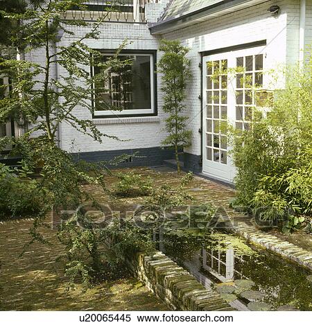 Pond and paving in town garden View Large Photo Image Stock Photography - Pond and paving in town garden. Fotosearch