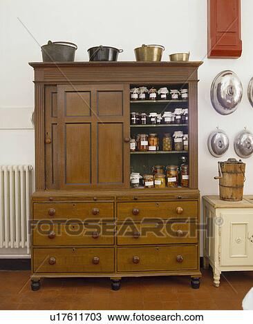 Preserves and jams stored in antique kitchen dresser View Large Photo Image Stock Image - Preserves and jams stored in antique kitchen dresser. Fotosearch