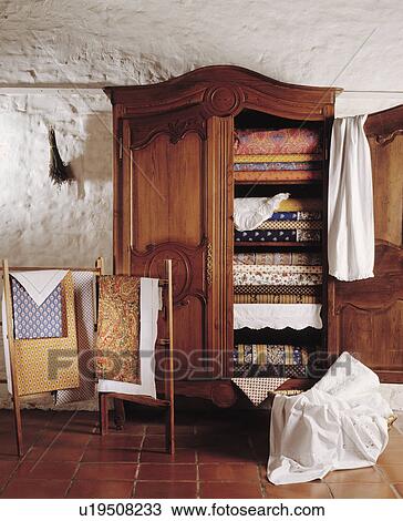 Provencal quilts in antique linen press View Large Photo Image Stock Image - Provencal quilts in antique linen press. Fotosearch