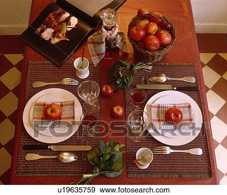 Red apples and white plates on table with red cloth View Large Photo Image Stock Photo - Red apples and white plates on table with red cloth. Fotosearch