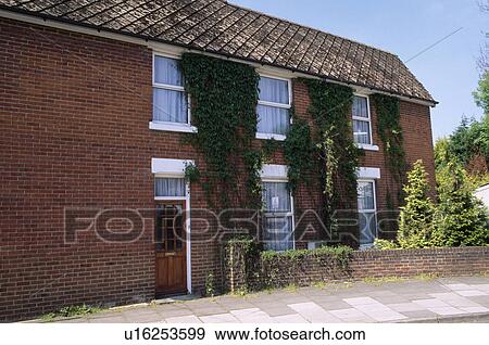 Stock Photo - Red brick house built in the seventies. Fotosearch