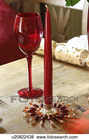 Red glass and candle on pine table. View Large Photo Image Stock Photo - Red glass and candle on pine table.. Fotosearch
