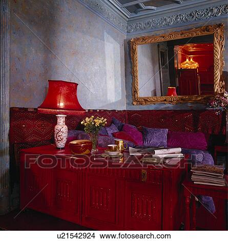 Red lamp on red carved chest in living room View Large Photo Image Picture - Red lamp on red carved chest in living room. Fotosearch