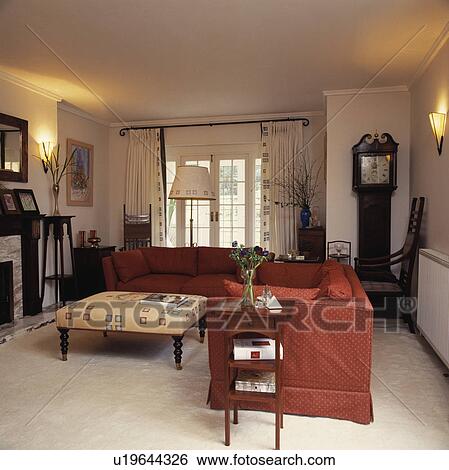 Stock Photograph - Red sofas in traditional living room. Fotosearch