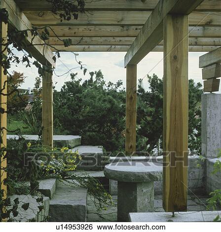 Rough stone furniture on patio in country garden View Large Photo Image Stock Photograph - Rough stone furniture on patio in country garden. Fotosearch