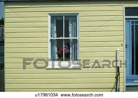 Sash window in yellow clapboard cottage View Large Photo Image Picture - Sash window in yellow clapboard cottage. Fotosearch