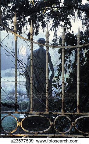 Stock Photo - Sculpture in country garden in winter. Fotosearch