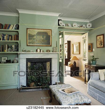 Shelf above door in traditional living room View Large Photo Image Stock Photography - Shelf above door in traditional living room. Fotosearch