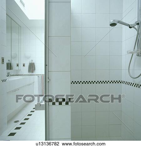 Stock Image - showers, interior, tiles, bath, monochromatics, white, interiors. Fotosearch