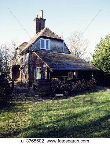 Side view of Victorian country cottage with wooden lean-to shed View Large Photo Image Stock Image - Side view of Victorian country cottage with wooden lean-to shed. Fotosearch