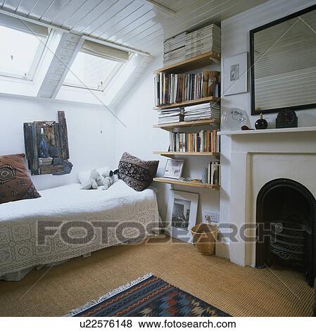 Single Bed In Teenager S White Attic Bedroom With Shelves Beside