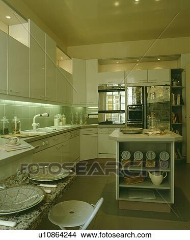 Small breakfast bar in modern grey kitchen with island unit View Large Photo Image Picture - Small breakfast bar in modern grey kitchen with island unit. Fotosearch