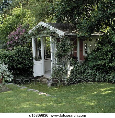 Small lawn in front of white summerhouse in country garden in summer View Large Photo Image Stock Photograph - Small lawn in front of white summerhouse in country garden in summer. Fotosearch