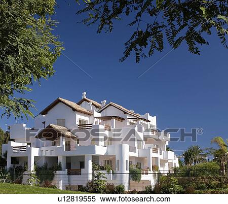 Small newbuild white apartment buildfing in Southern Spain View Large Photo Image Stock Photography - Small newbuild white apartment buildfing in Southern Spain. Fotosearch