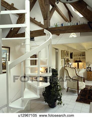 Spiral staircase in white country living room View Large Photo Image Stock Photography - Spiral staircase in white country living room. Fotosearch