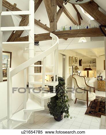 Spiral staircase in white country living room View Large Photo Image Stock Photography - Spiral staircase in white country living room. Fotosearch