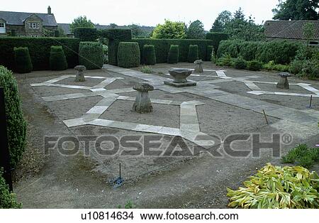 Picture - Staddlestones in formal garden before planting. Fotosearch