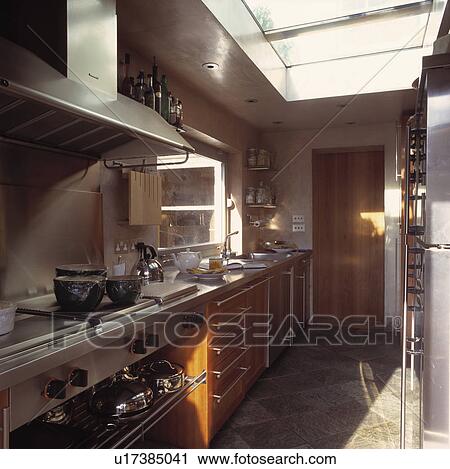 Stainless steel range oven in modern galley kitchen extension View Large Photo Image Stock Image - Stainless steel range oven in modern galley kitchen extension. Fotosearch