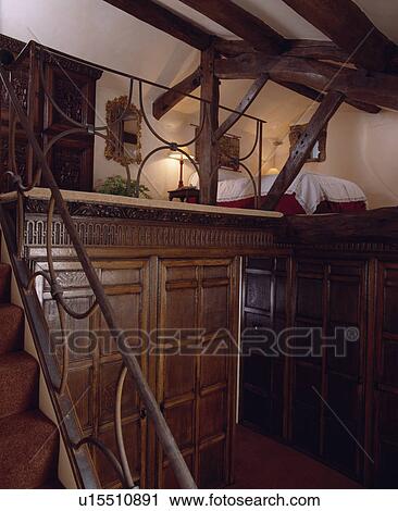 Stairs Leading To Bed On Mezzanine Floor Above Panelled Wall