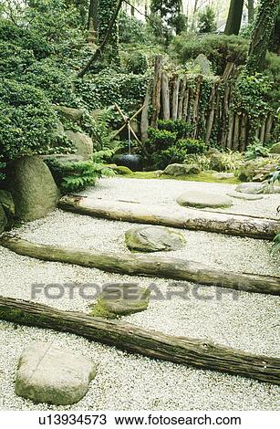 Stepping stones in gravel and log steps in oriental style garden View Large Photo Image Stock Image - Stepping stones in gravel and log steps in oriental style garden. Fotosearch