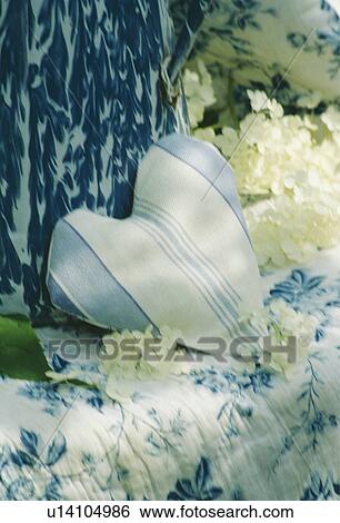Stock Photograph - Still-Life of blue+white striped fabric heart. Fotosearch