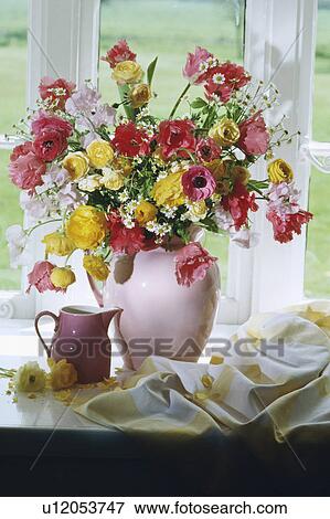 Still-Life of floral arrangement of pink and yellow flowers View Large Photo Image Stock Photo - Still-Life of floral arrangement of pink and yellow flowers. Fotosearch