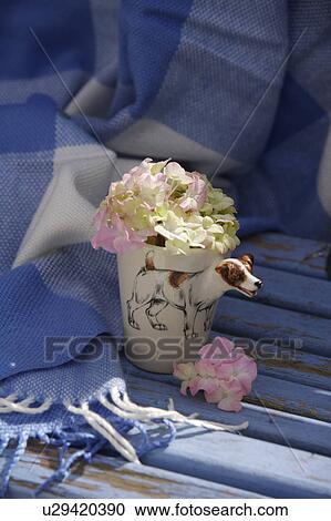 Stock Image - Still-Life of pink hydrangeas in novelty cup. Fotosearch